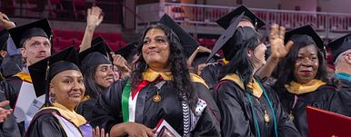 Graduates waving
