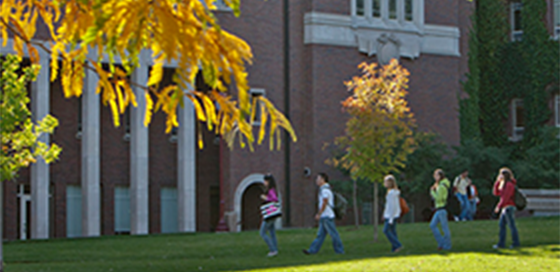 people walking in front of the Daniels building